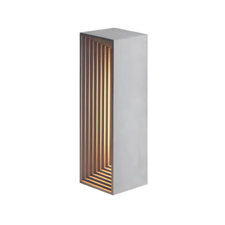 Cement table lamp illuminated — architectural LED warm glow