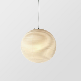 White Nordic paper lantern pendant casting soft glow