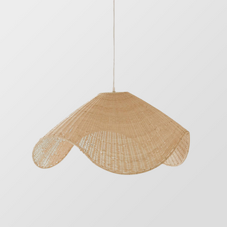 Rattan handwoven pendant casting warm patterned shadows