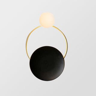 Vintage industrial circle black gold wall sconce close-up