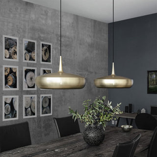 Metal chandelier in interior — warm glow modern dining lamp