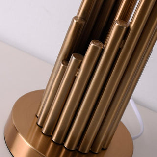 Architectural spire lamp illuminated — warm gold ambient glow