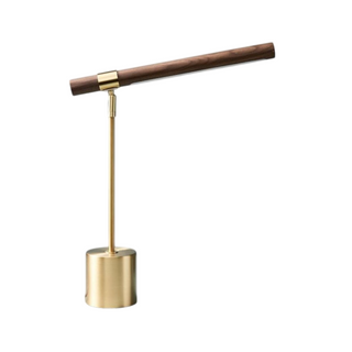 Brass base dark wood shade lamp front — minimalist design