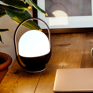 Black white metal lamp close-up — portable LED detail