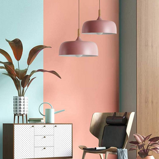 Industrial pendant close-up — small cream metal glass lamp