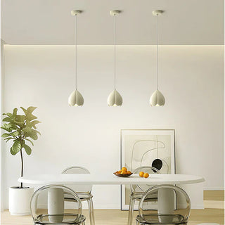 Rustic pendant light with cream shade over dining table