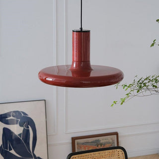 Red metal saucer pendant lamp detail — modern dining fixture