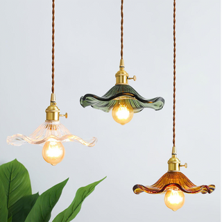 Fluted glass pendant showing brushed brass fixture detail