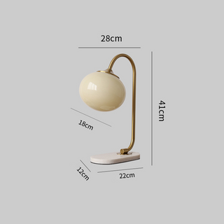 Marshmallow glass table lamp wide view — metal warm