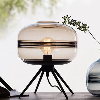 Glass lamp tripod detail — warm white LED fixture