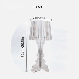 Acrylic brass table lamp illuminated — crystal chandelier glow