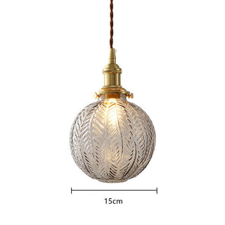 Elegant glass globe pendant light in interior — black gold finish