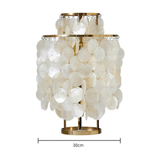 Seashell table lamp detail — pearl wind chimes texture