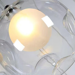 Cluster globe pendant in stairway interior — adjustable height lamp