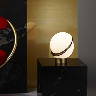 Golden white table lamp close-up — elegant design detail