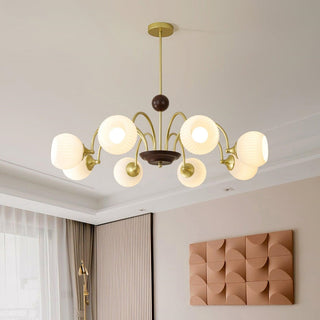Contemporary cream chandelier illuminated — ribbed glass dining warm