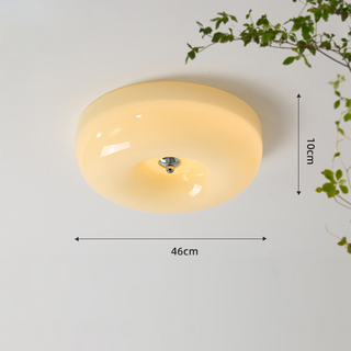 Soft ambient cream ceiling fixture with glass dome, bedroom lighting