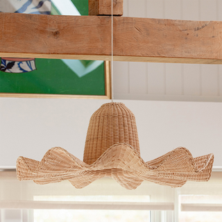 Large handwoven rattan pendant with natural wood finish
