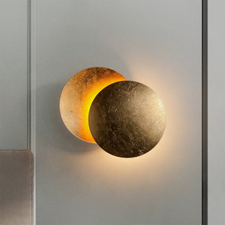 Modern round rotating LED wall lamp in living room — sconce