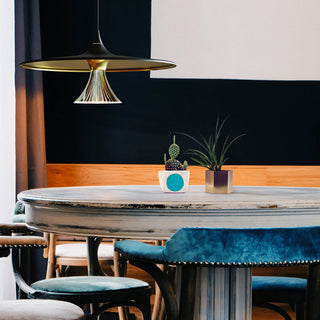 Flying saucer pendant close-up — concrete shade modern lamp