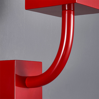 Red metal wall lamp close-up — vintage retro sconce light