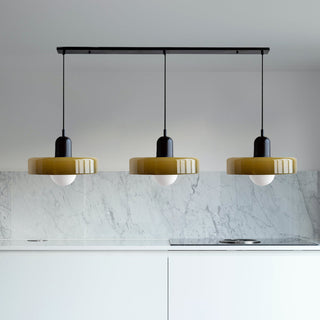 Bauhaus pendant with three glass lamp heads over table