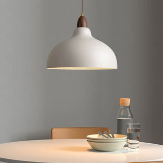 Contemporary pot-shaped pendant over kitchen island