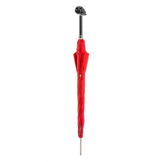 Red automatic Italian skull handle studded umbrella close-up