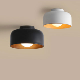Bowl shaped metal ceiling fixture illuminated, minimalist design