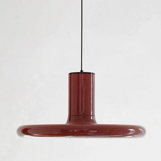 Modern red saucer pendant lamp hanging in dining room