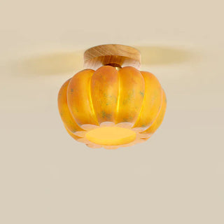 Pumpkin-shaped ceiling lamp in yellow resin, cozy ambient lighting