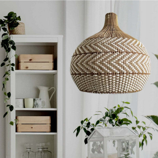 Handwoven pendant detail — rattan adjustable ceiling fixture