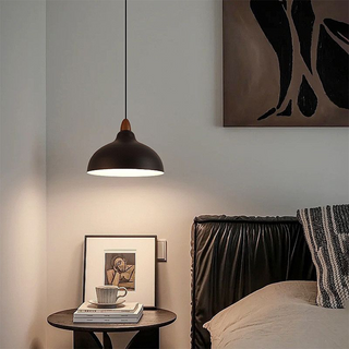Pot-shaped pendant casting warm beam in dining room