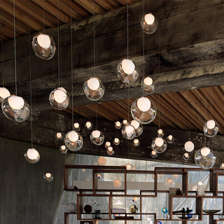 Stairway cluster pendant from below — glass globe adjustable fixture