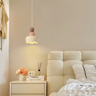 Cream warm glow pendant from below — bedside adjustable light