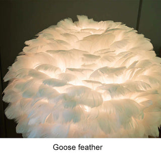 Feather table lamp with tripod base — elegant warm ambient