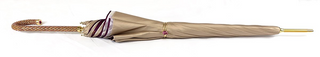 Elegant cream double fabric umbrella jeweled gold handle close-up