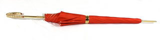Elegant red leopard umbrella double cloth gold handle close-up
