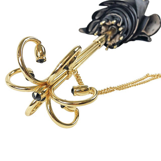 Black cream dot umbrella – gold handle closed view