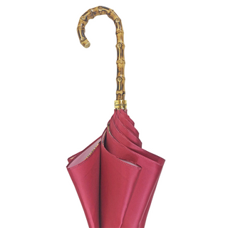 Elegant burgundy satin umbrella natural bamboo handle close-up