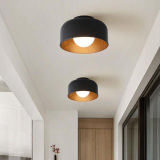 Sleek metal bowl ceiling lamp in room, minimalist design