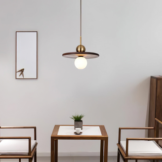Walnut pendant with modern saucer design and brass globe