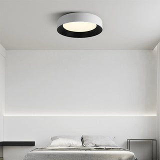 Modern black metal ceiling light close-up, flush mount LED
