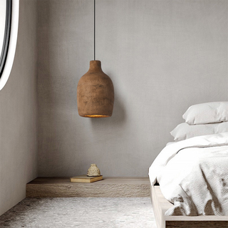 Artistic pendant close-up — postmodern pottery brown lamp