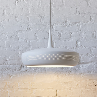 Modern metal chandelier side view — warm glow dining fixture