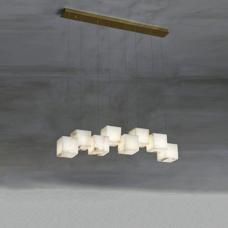 White alabaster pendant hanging in modern interior — geometric fixture