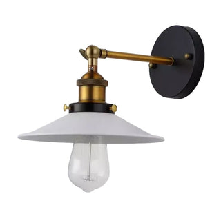 A wall-mounted light fixture with a white shade and a brass-colored metal arm extending from the wall.