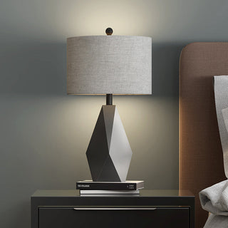 Stone faceted base table lamp — grey fabric shade side view