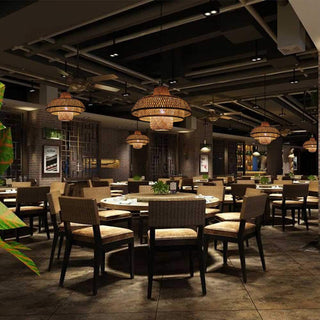 Rattan dome pendant casting warm light — cozy interior