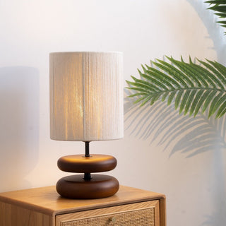 Wood wave desk lamp illuminated — contemporary warm ambient